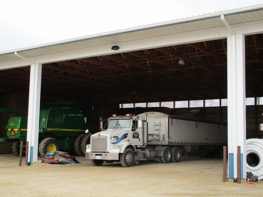 Dale - Galien, MI 80 x 136 x 20 Farm Equipment storage building. White with Blue wainscot.