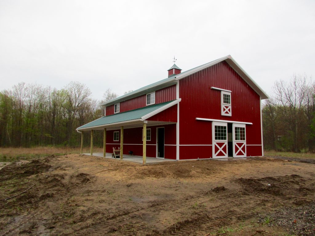 David - Buffalo, MI 30 x 40 x 17 with an 8 x 40 porch with Forest Green roof, Rustic Red sides and White trim.