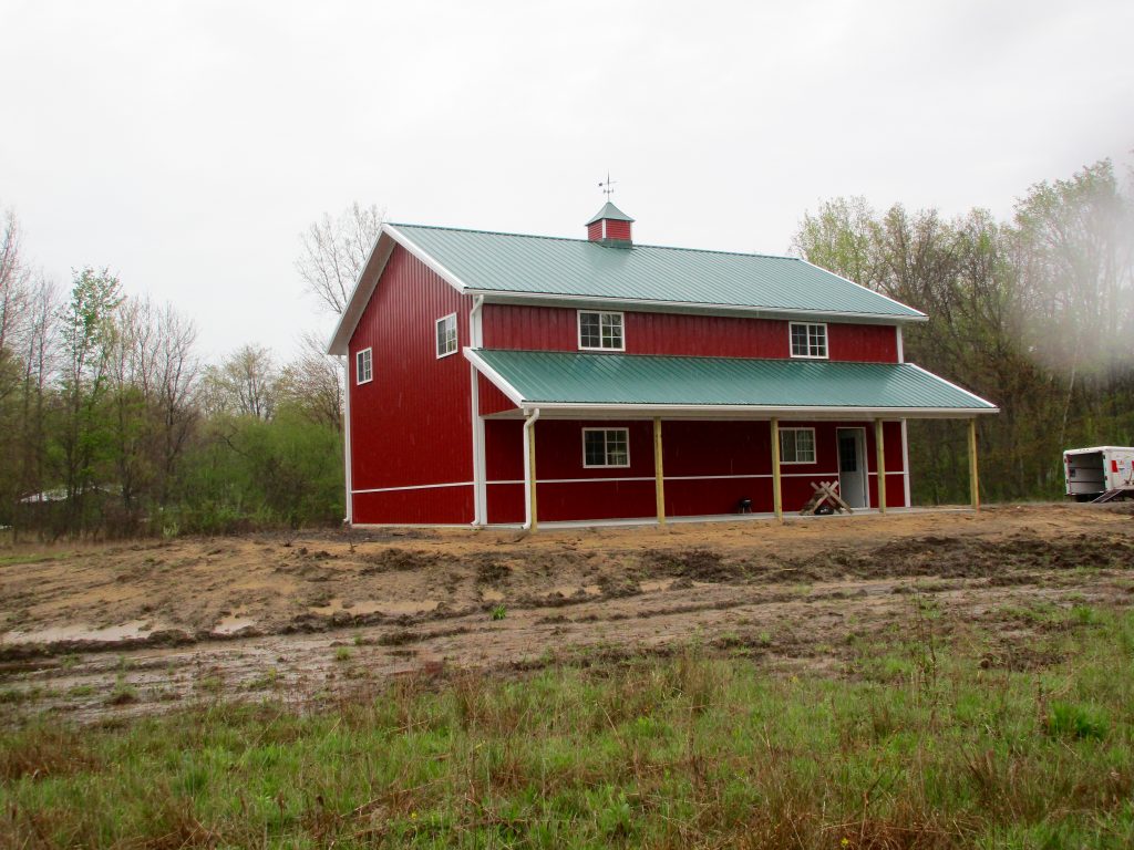David - Buffalo, MI 30 x 40 x 17 with an 8 x 40 porch with Forest Green roof, Rustic Red sides and White trim.