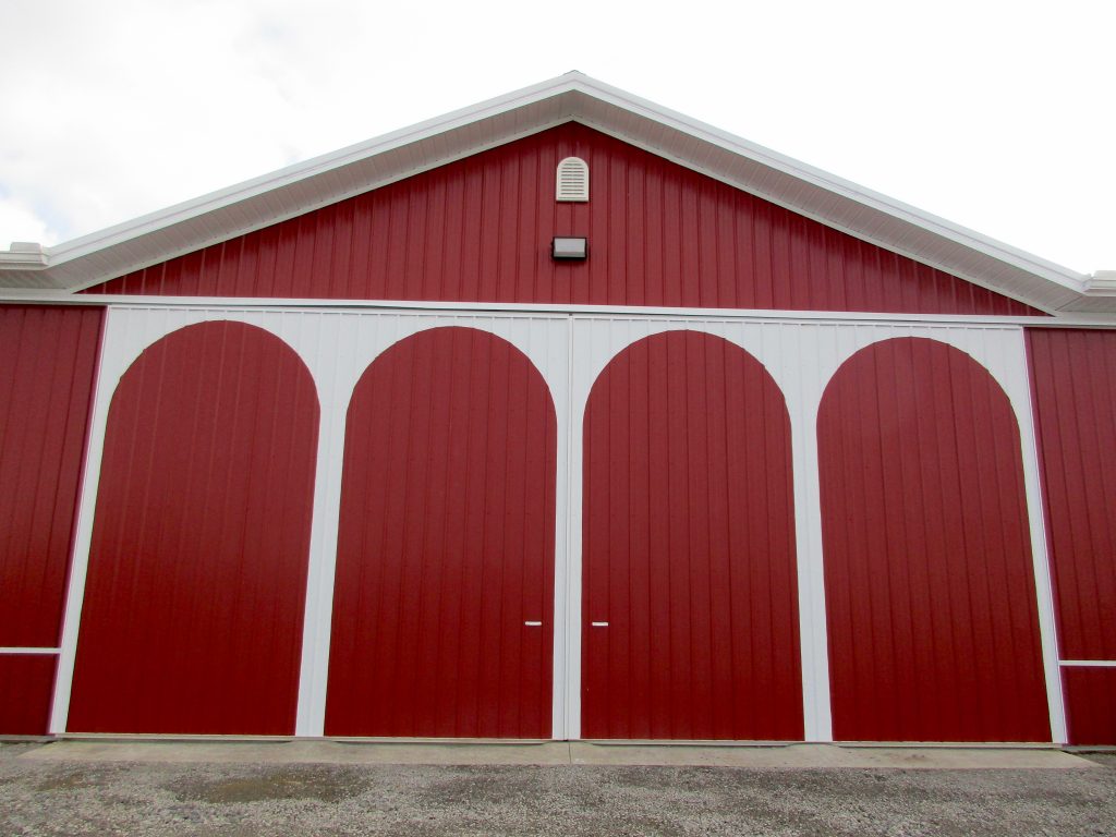 Herbert - Milford, IN 80 x 120 x 17 Farm Building with Arch Design on sliding doors. White roof with Rustic Red sides.
