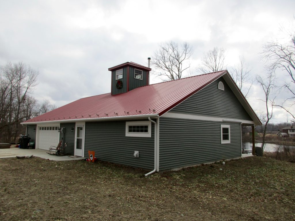 Jeff - Mentone, IN 30 x 60 x 8 House:Garage with 8 x 8 Cupola, and 8 x 60 porch. Metal roof and vinyl siding.