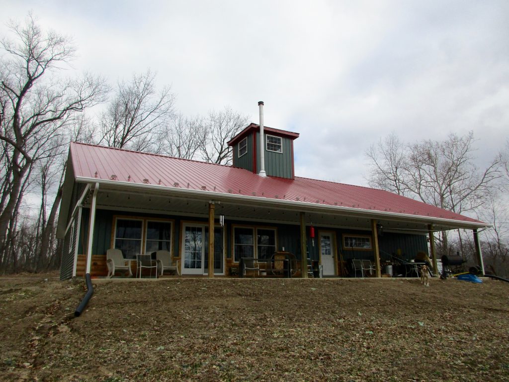 Jeff - Mentone, IN 30 x 60 x 8 House:Garage with 8 x 8 Cupola, and 8 x 60 porch. Metal roof and vinyl siding.