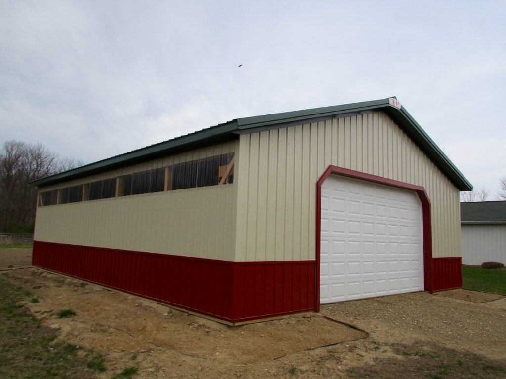 Paul - Buchanan, MI 30 x 40 x 10 Garage. Hunter Green roof and fascia with Rustic Red wainscot, and Light Stone sides.