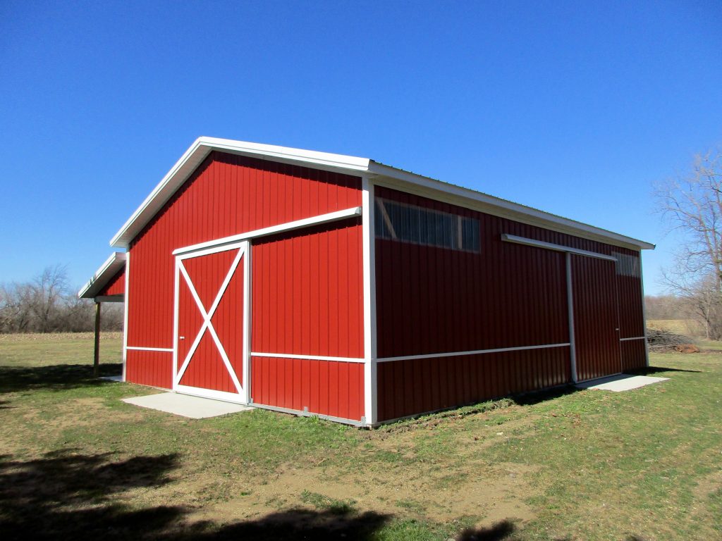 Doug-Buchanan, MI 30x40x12 with 8x40 porch. Hunter Green roof, and Rustic Red sides.