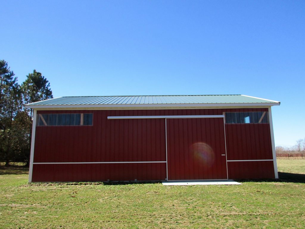 Doug-Buchanan, MI 30x40x12 with 8x40 porch. Hunter Green roof, and Rustic Red sides.
