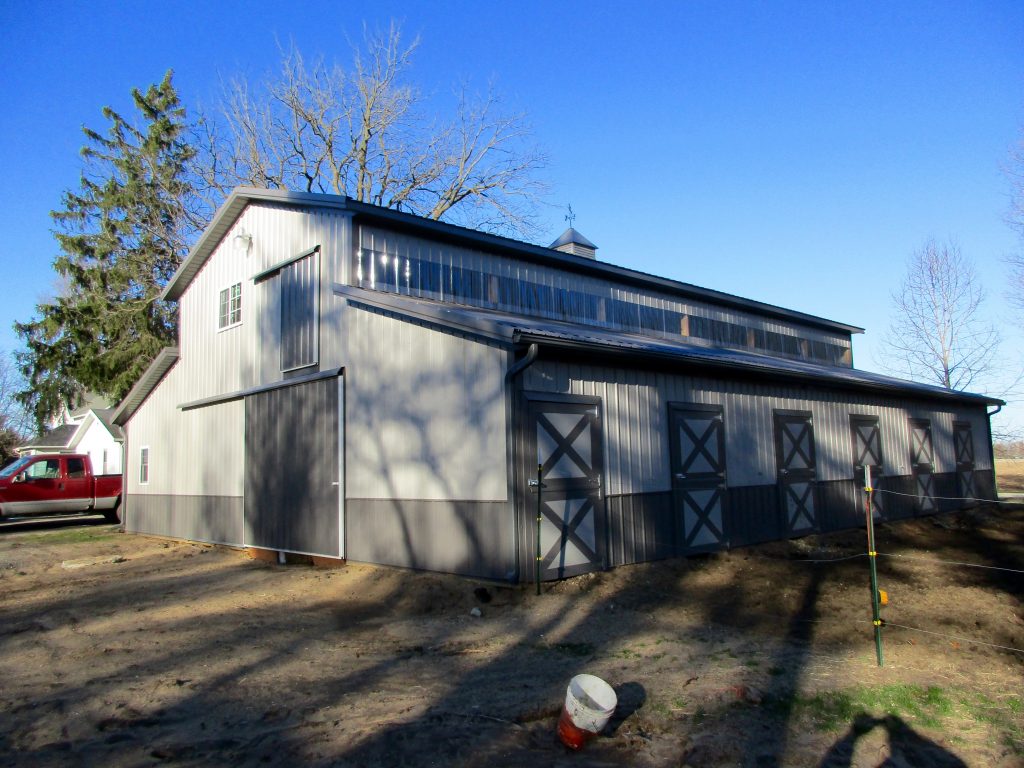 Kathy-Rolling Prairie, IN 24x60x17 with two 12x60x9 lean toos. Charcoal roof, and Grey sides.