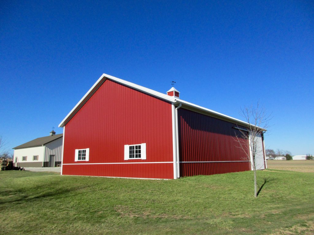 Terry-Three Oaks, MI 40x56x14 White Roof, and Rustic Red sides.